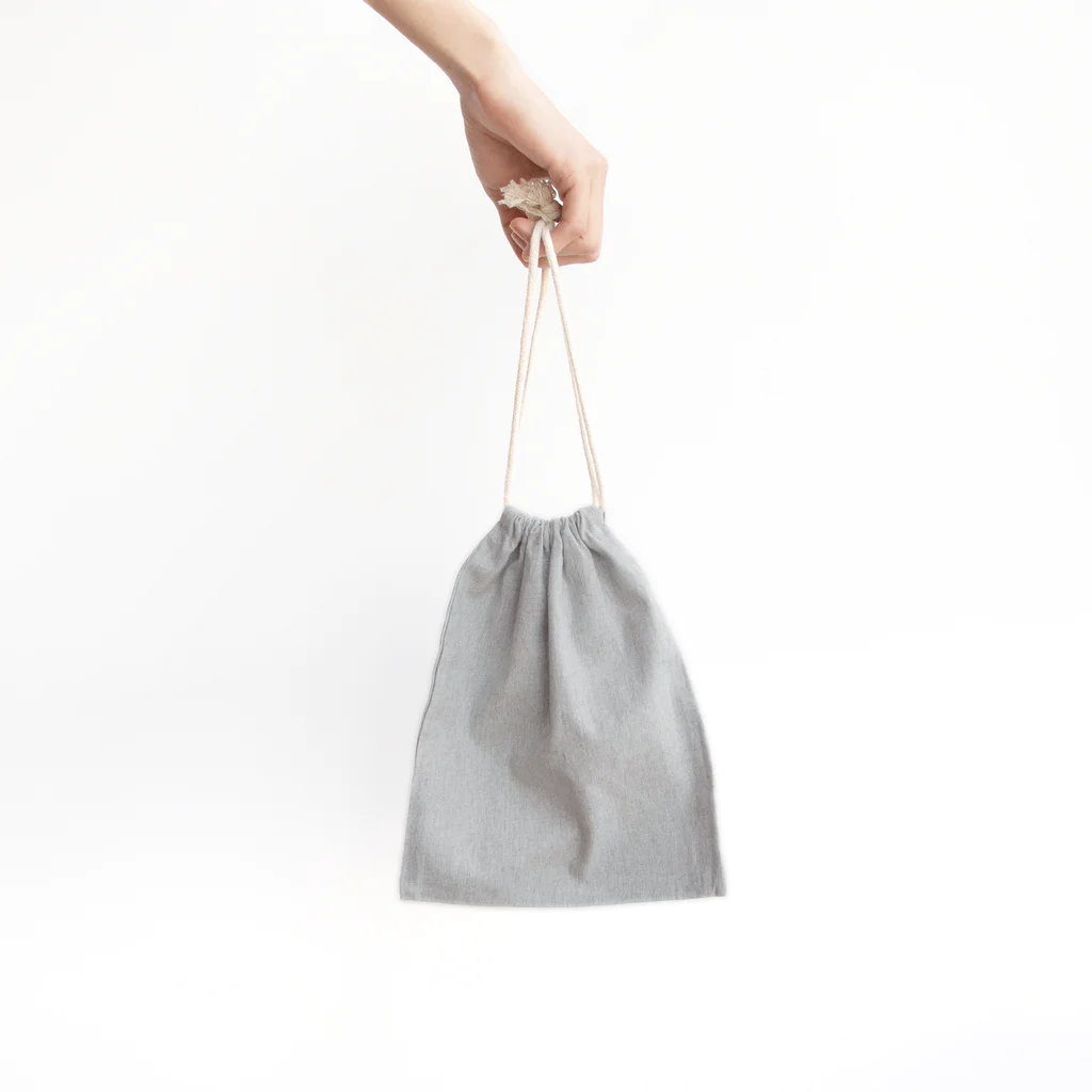 おでんたべたいの喜喜 Mini Drawstring Bag is large enough to hold a book or notebook